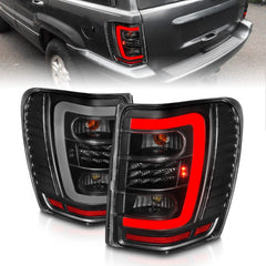 AnzoUSA 311394 LED Tail Lights with Light Bar Black Housing Clear Lens