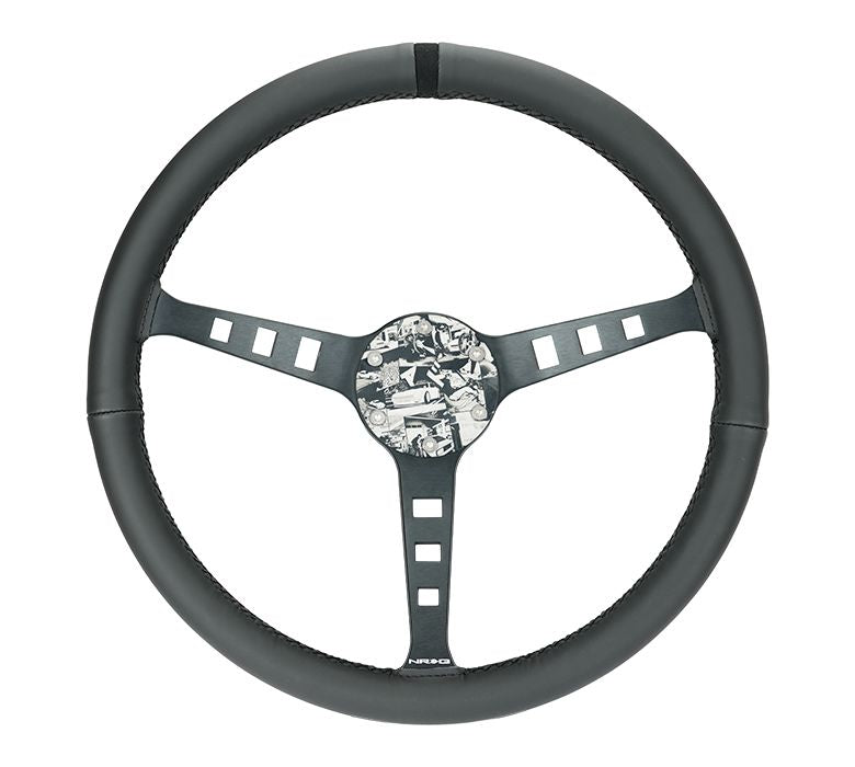 NRG Innovations Reinforced Steering Wheel - Fuguz x NRG collaboration 1.5" Deep, 5mm matte black spoke, 380mm Sport Steering Wheel Black leather w/ black stitching iconic episode 2 laser engraving RST-380SK-EP2